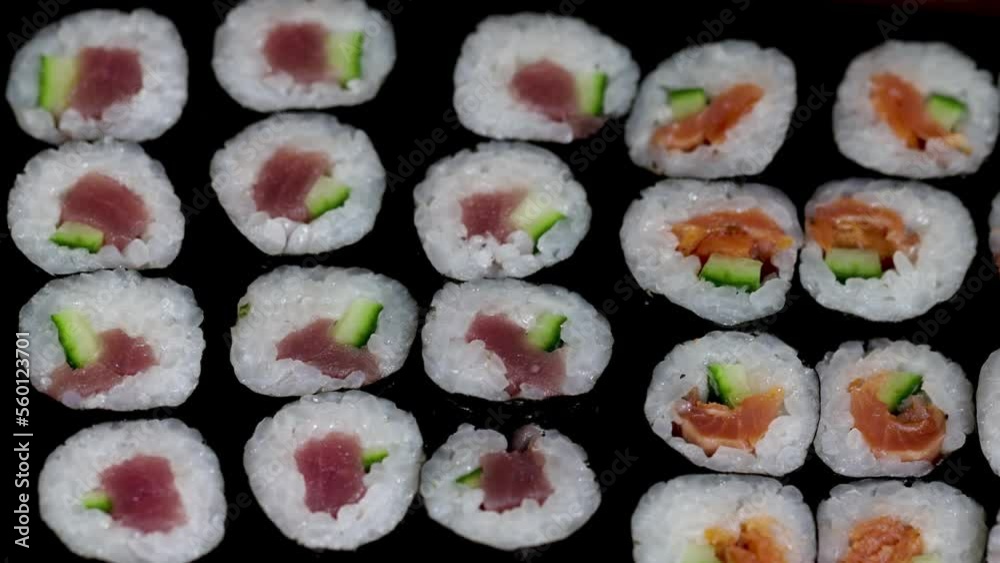 Close up sushi rolls. Japanese food with avocado, salmon, tuna. Close up sushi rolls. Japanese food with avocado, salmon, tuna.