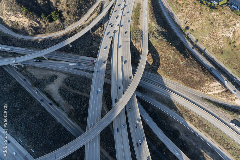 Aerial down view of the Golden State 5 and Antelope Valley 14 freeway interchange bridges in the Newhall Pass north of Los Angeles California.. Aerial down view of the Golden State 5 and Antelope Valley 14 freeway interchange bridges in the Newhall Pass north of Los Angeles California..