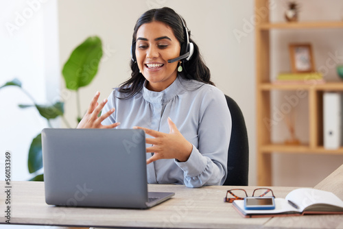 Video call, laptop and seminar with a business indian woman meeting online while sitting in her office at work. Remote work, headset and communication with a female employee talking in a webinar