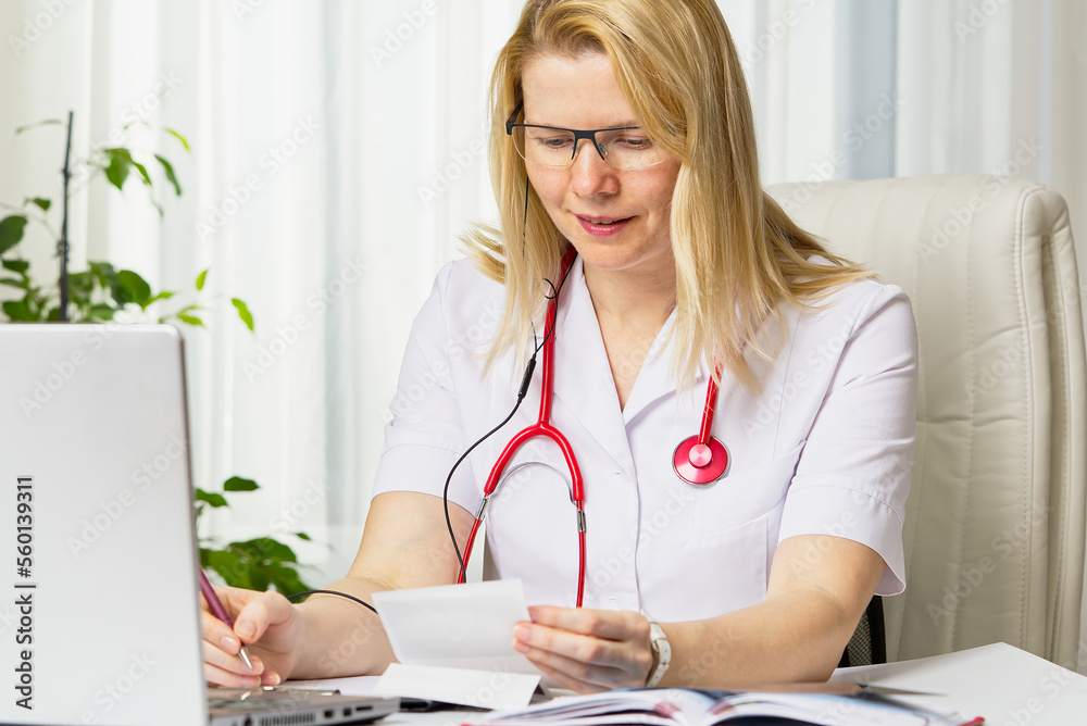 Female doctor showing her patient picture of ultrasound image of her ...