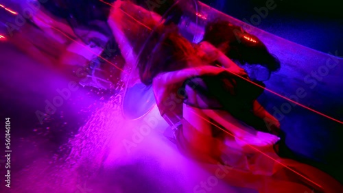 tender embrace of two lesbians women inside depth of amazing fabulous pool or bath, female figures