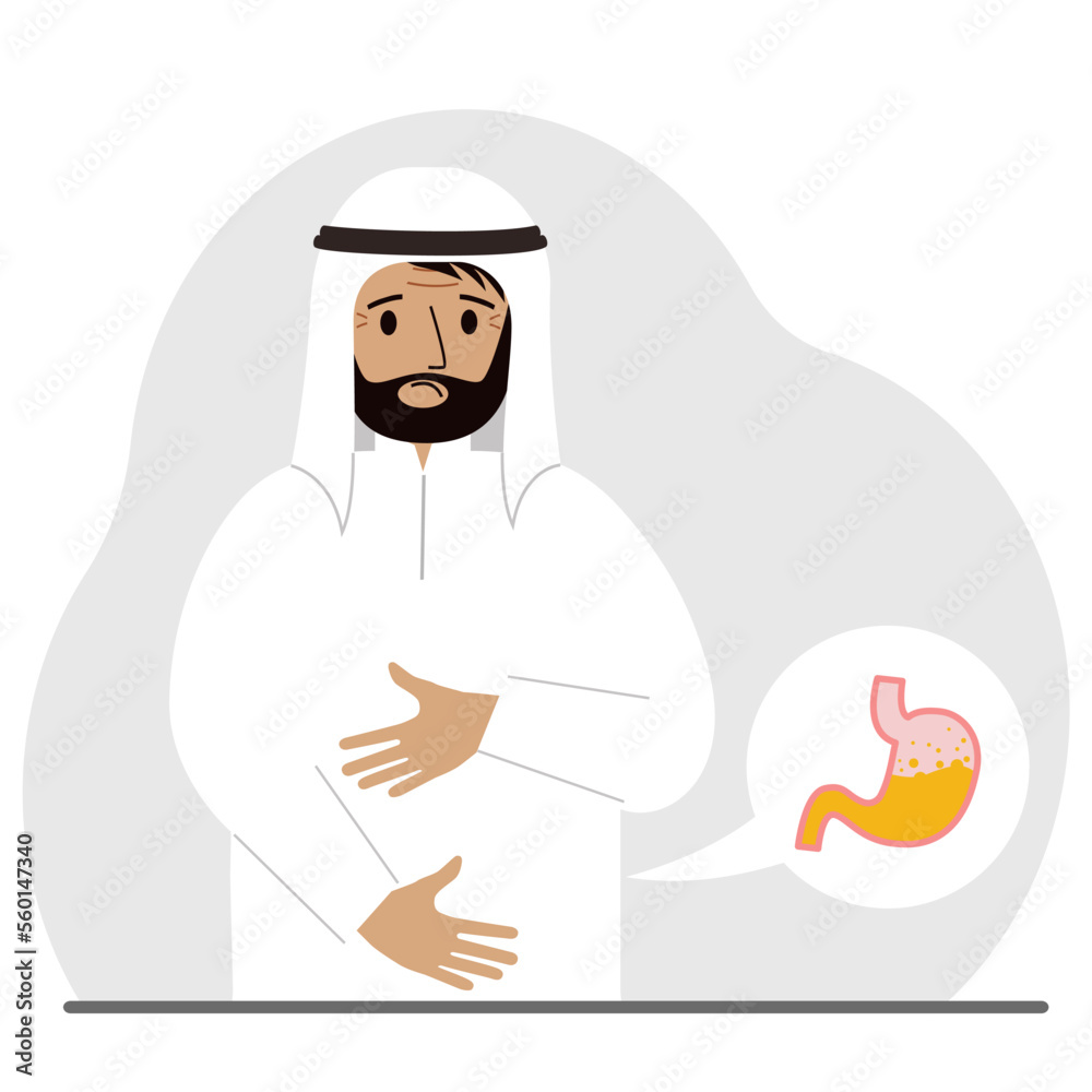 The concept of pain in the abdomen. The arab man holds his stomach with both hands. Problems with the stomach or digestion.