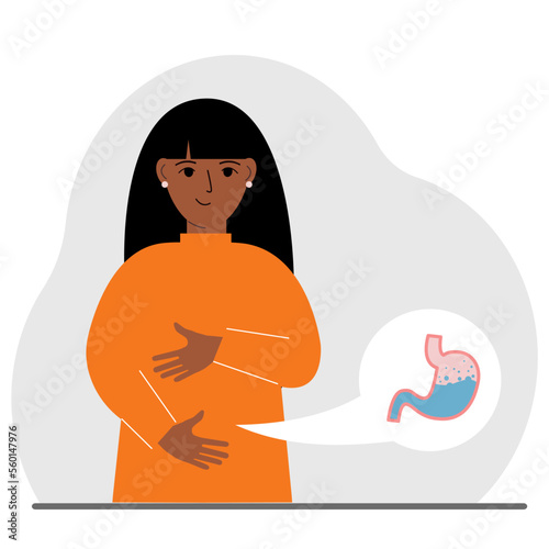 The concept of a healthy stomach. The woman holds her stomach with both hands. A healthy stomach or proper digestion.
