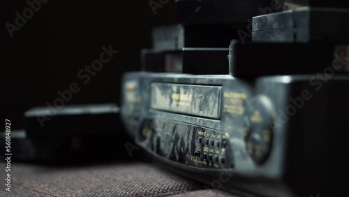 Vhs Tape Being Placed Into Dusty Tape Deck