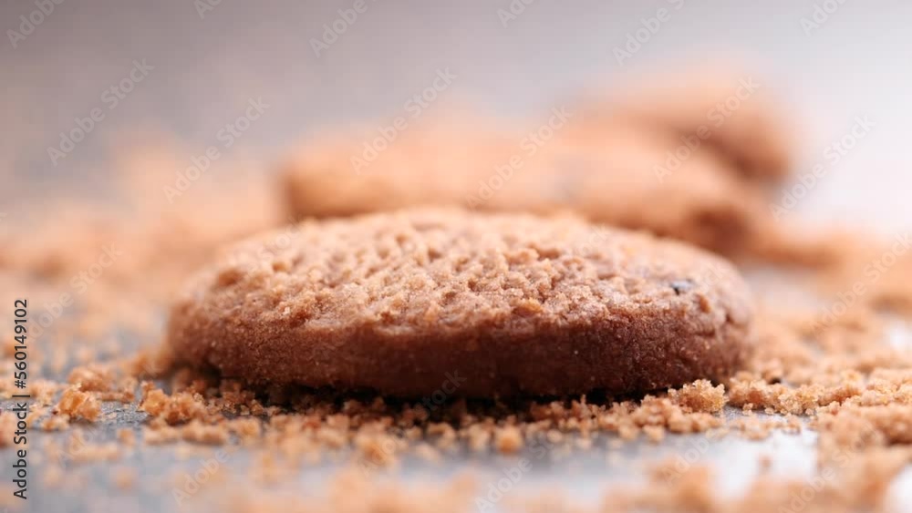 Chocolate chip cookies falling, dropping into table, slow motion. Concept of Cookies, Dessert, Snack, Biscuit, Chocolate Cookies, Bakery, American Food, Unhealthy Food Chocolate chip cookies falling, dropping into table, slow motion. Concept of Cookies, Dessert, Snack, Biscuit, Chocolate Cookies, Bakery, American Food, Unhealthy Food