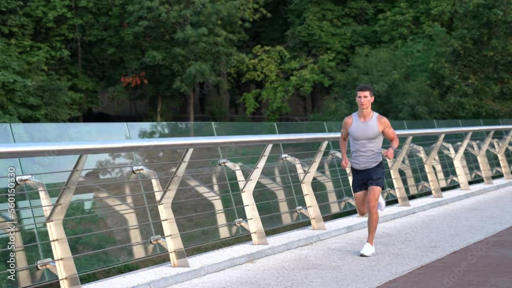 athletic muscular guy in sportswear running with sense of freedom, stamina athletic muscular guy in sportswear running with sense of freedom, stamina