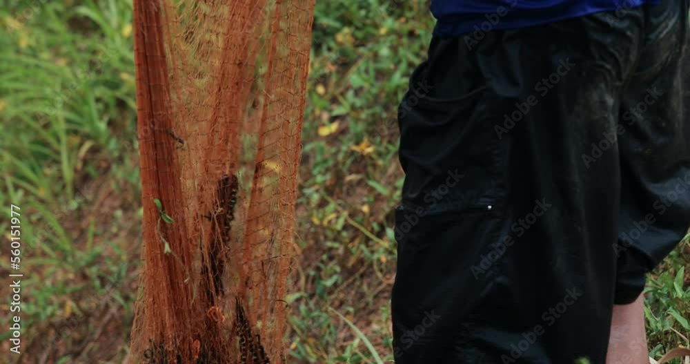 Asian man is preparing fishing net at countryside