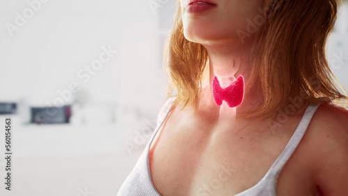 A woman with a red sick thyroid gland on her neck (ID: 560154563)