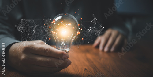 hand hold light bulb.Inspiration and Creativity Concepts.Innovation technology in science and communication network connection.