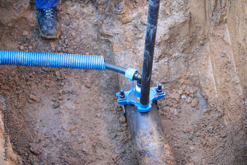 Construction worker, repairing a broken water pipe
Construction site with new Water Pipes in the ground. Plumber work repair water line connect.