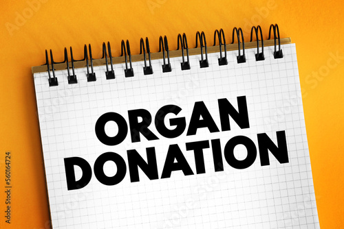 Organ donation - process of surgically removing an organ or tissue from one person and placing it into another person, text concept on notepad photo