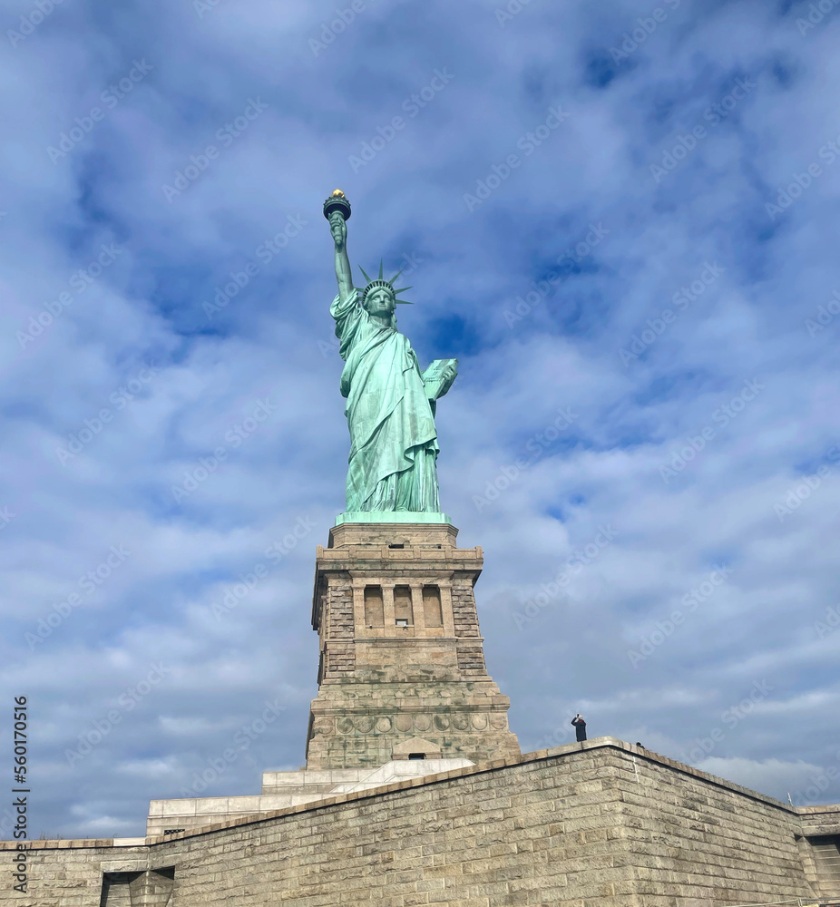 Low angle and dyamic Statue of Liberty with blue sky in the United States . Statue of Liberty in USA