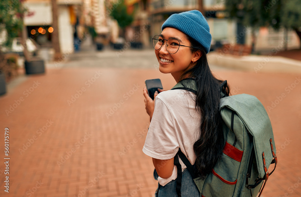 Asian female tourist student on city streets - obrazy, fototapety, plakaty 