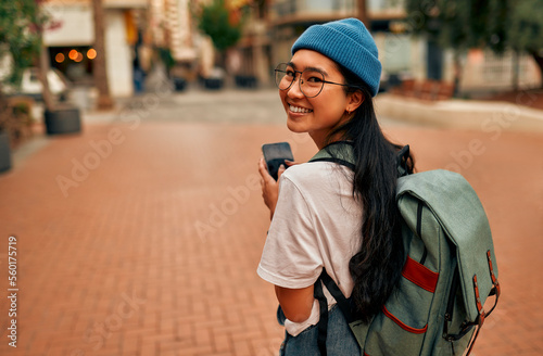 Slika na platnu Asian female tourist student on city streets