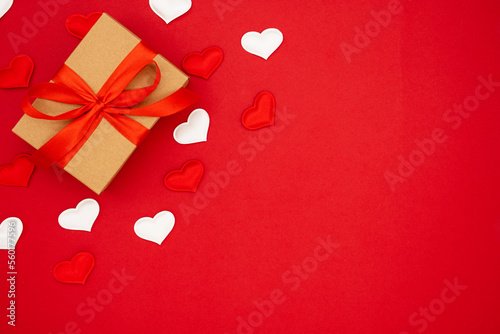 Valentine's Day background. Red and white hearts and box for St. Valentine's day gift. Concept of Valentine's, anniversary, mother's day and birthday greeting, copy space, top view © Jenya Smyk