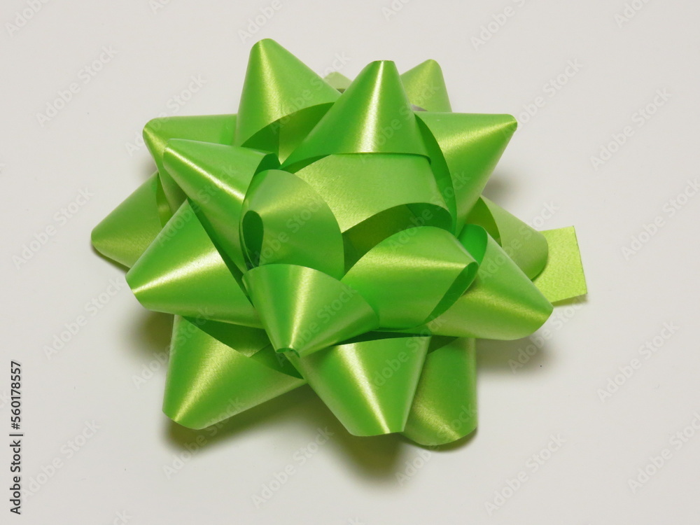 a Ribbon bow banner in green color on white paper background