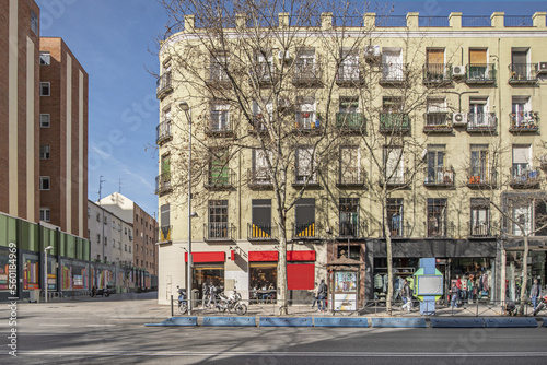 Fototapeta Naklejka Na Ścianę i Meble -  Facade of a building at street level on a sunny winter day