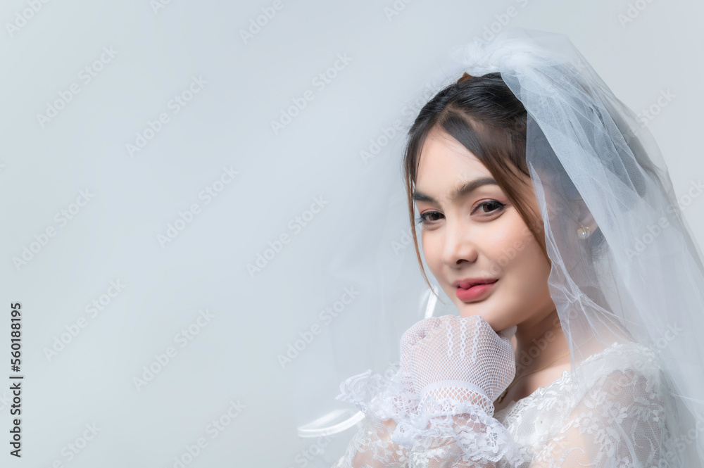 Portrait of asian woman wear bride with flower on white background,Wedding concept Portrait of asian woman wear bride with flower on white background,Wedding concept