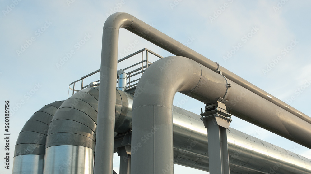 Naklejka premium pipeline close-up, in the photo pipeline blue sky and clouds, bottom view