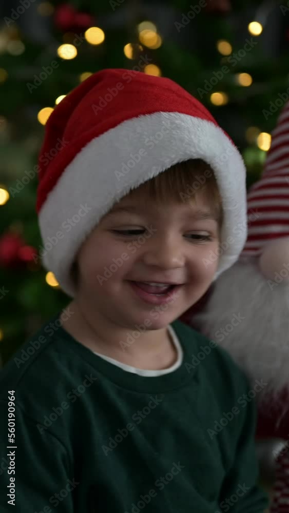 Vertical Video.Happy child at home on christmas