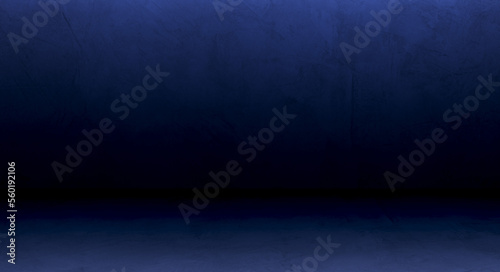 Dark blue wall studio background with soft light and free space for editing montage display product and text present on backdrop 