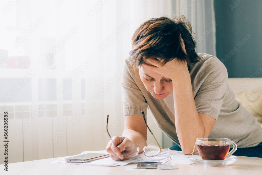 Depressed adult woman covers her face with her hands, cries, feels despair, grief, bad news Depressed adult woman covers her face with her hands, cries, feels despair, grief, bad news