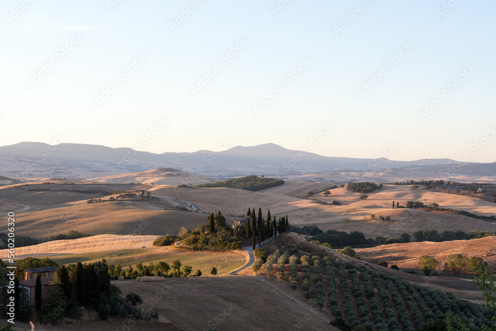 View from above, stunning aerial view of the Val D'Orcia during a beautiful sunrise. Val D'Orcia is a wide and beautiful countryside in southern Tuscany.