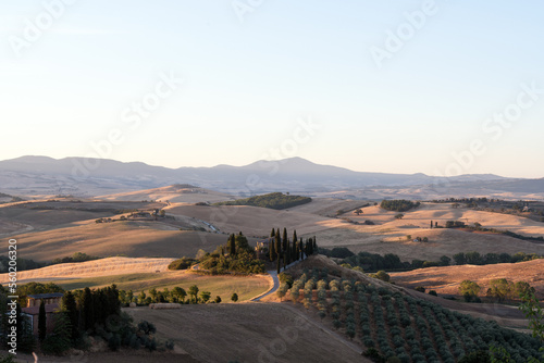 Obraz na płótnie View from above, stunning aerial view of the Val D'Orcia during a beautiful sunrise. Val D'Orcia is a wide and beautiful countryside in southern Tuscany. w salonie