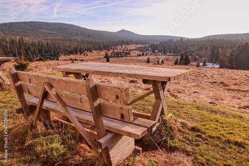 A picnic seat and table with beautiful view to the valley and mountain Lusen at Breznik, Czech republic