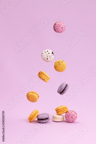 Sweet colorful macarons falling down photo