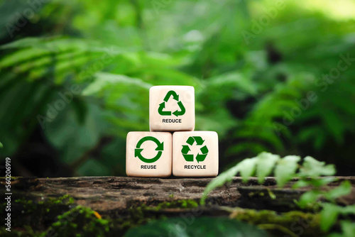 Reduce, reuse and recycle symbols on wood blocks as environmental conservation concept, Ecology, zero waste, sustainability, conscious consumerism, renew, concept. photo