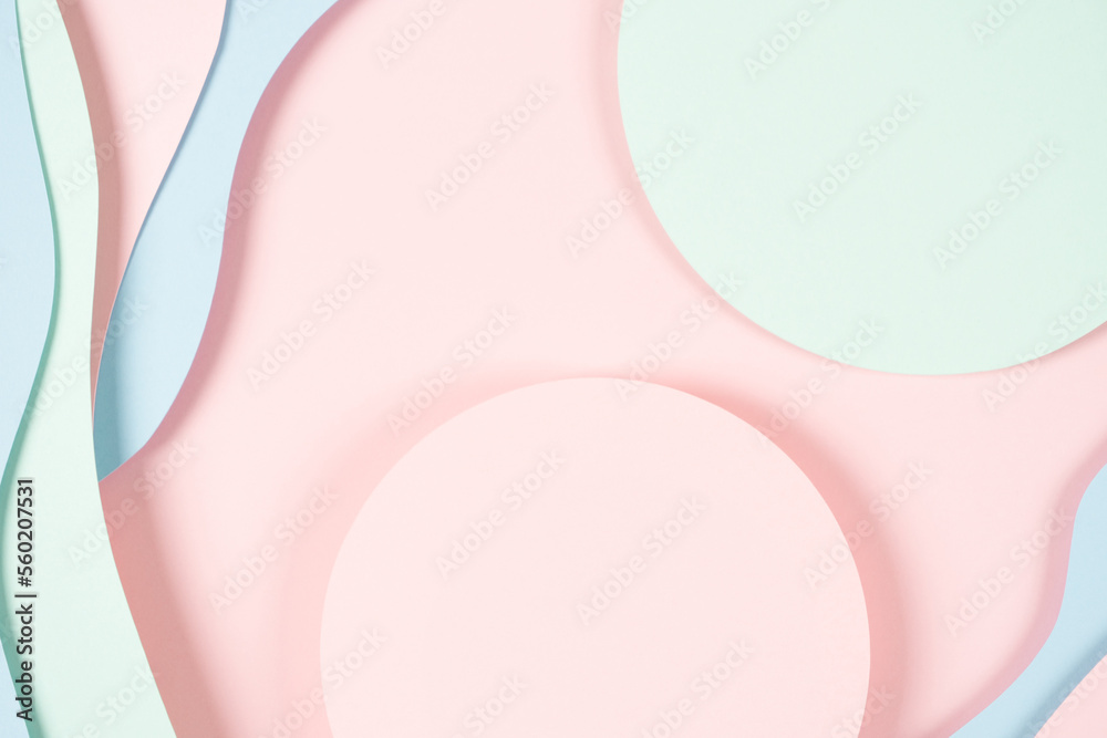 Abstract colored paper texture background. Minimal paper cut composition with layers of geometric shapes and lines in pastel green, pink and light blue colors. Top view, copy space Abstract colored paper texture background. Minimal paper cut composition with layers of geometric shapes and lines in pastel green, pink and light blue colors. Top view, copy space