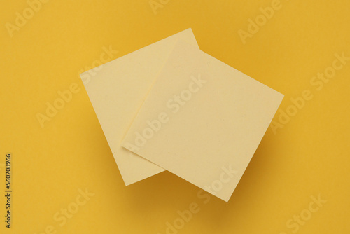 Yellow memo papers on a yellow background