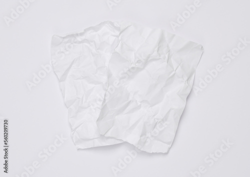 White crumpled sheets of paper on a white background