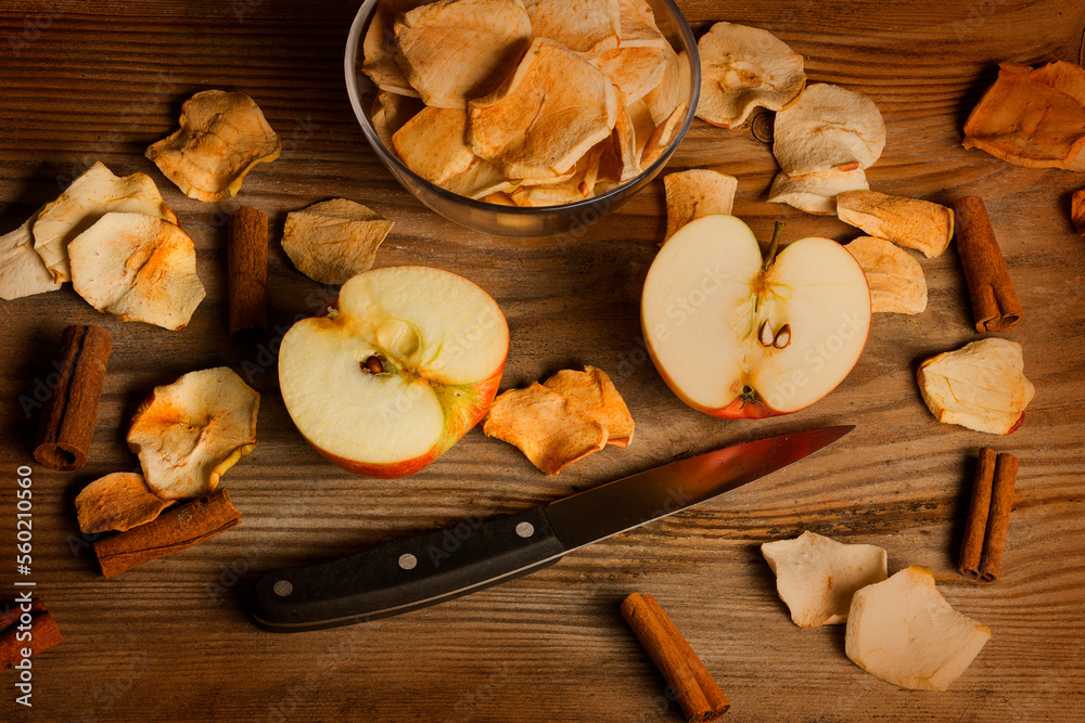 dried apple slices on the wooden table close up dried apple slices on the wooden table close up