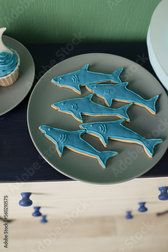 Gingerbread in the shape of a shark on a plate, for holiday decoration photo