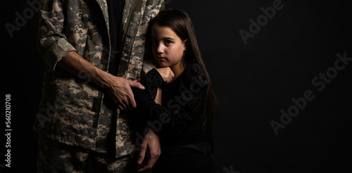 Fényképezés Masculine sad military man hugging her upset daughter indoors