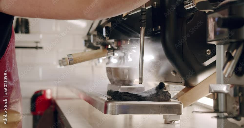 Pouring coffee stream from machine in cup. Espresso in a white cup. Espresso machine making fresh coffee. Flowing fresh ground coffee. Drinking roasted black coffee. Pouring coffee stream from machine in cup. Espresso in a white cup. Espresso machine making fresh coffee. Flowing fresh ground coffee. Drinking roasted black coffee.