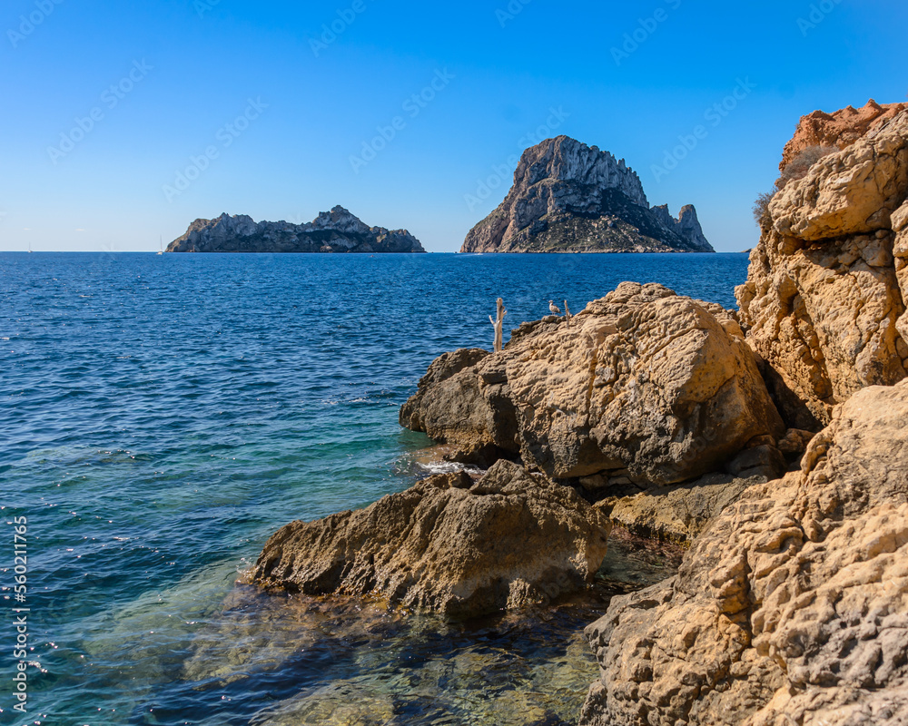 Panoramic views of the island of Es Vedra and Vedranell, located on the coast of the island of Ibiza. In front of the Cala d'Hort beach, one of the most visited by tourists.