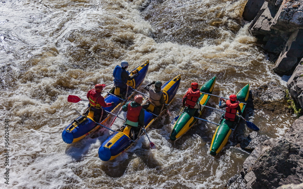 Catamaran water sports competitions on a full-flowing river in spring Catamaran water sports competitions on a full-flowing river in spring