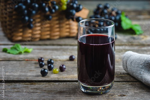 freshly squeezed grape juice on a rustic wooden table. healthy eating