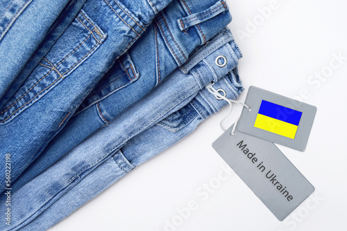 Detail of blue jeans, label and Made in Ukraine lettering.