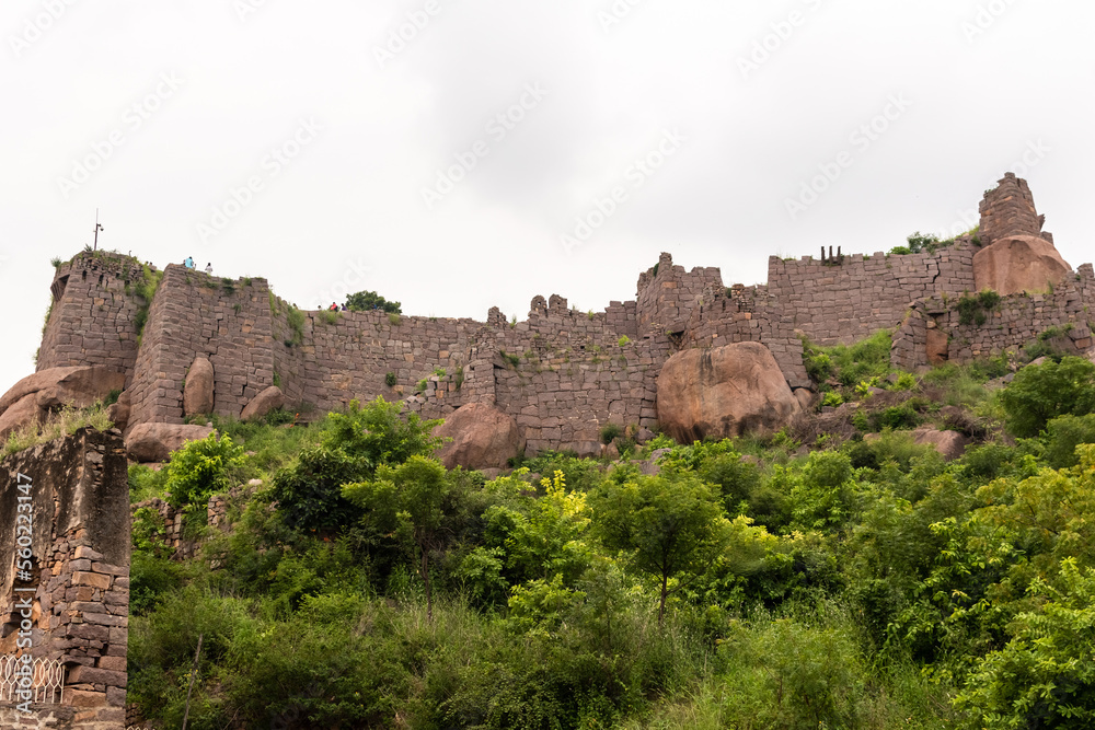 Low angle view of the stone fortification walls of the ancient Golconda Fort.