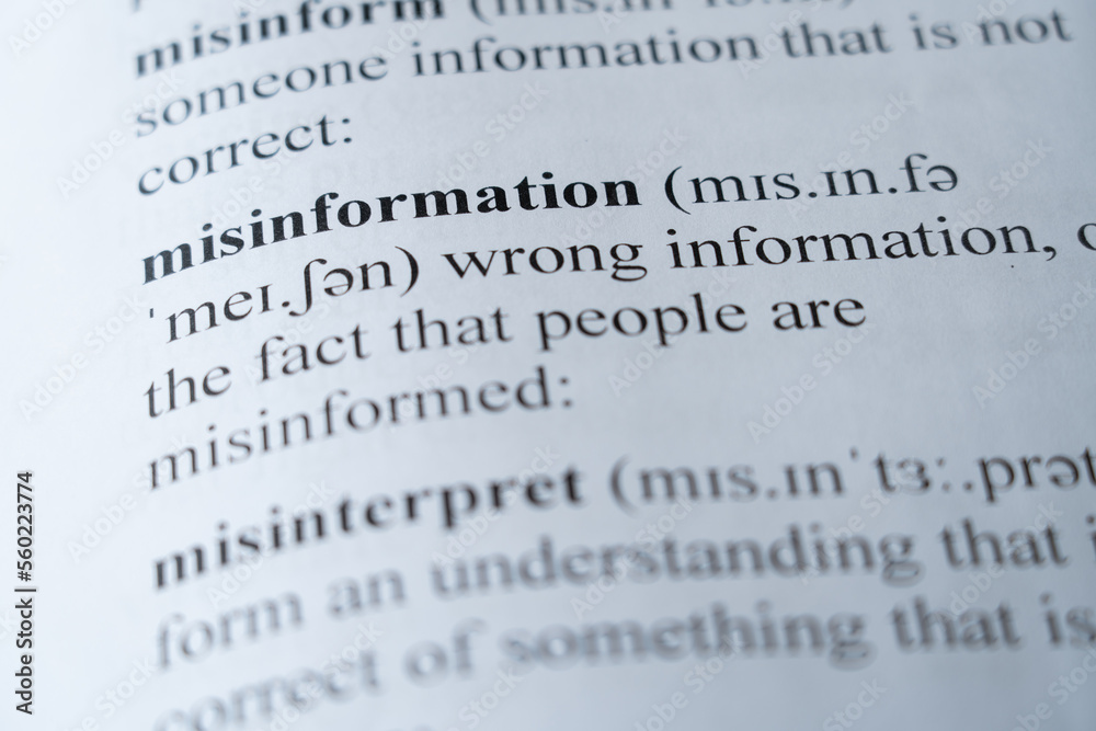 A mock up of a dictionary page with the word misinformation with selective focussing