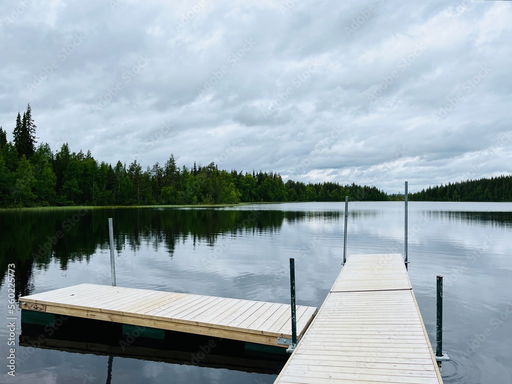 Wooden pier at the lake, peaceful, no people Wooden pier at the lake, peaceful, no people