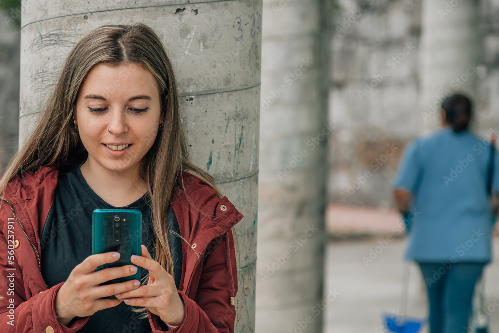 Fototapeta premium student at school looking at mobile phone