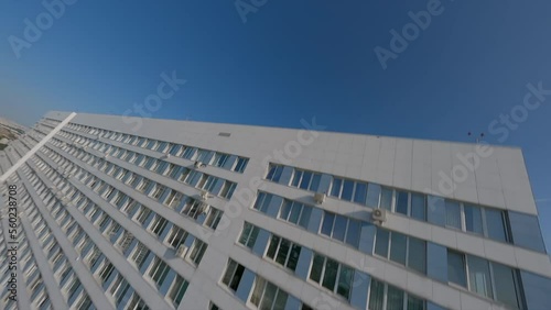 Dynamic fpv spans along and near multi-storey buildings, industrial cinematic photo