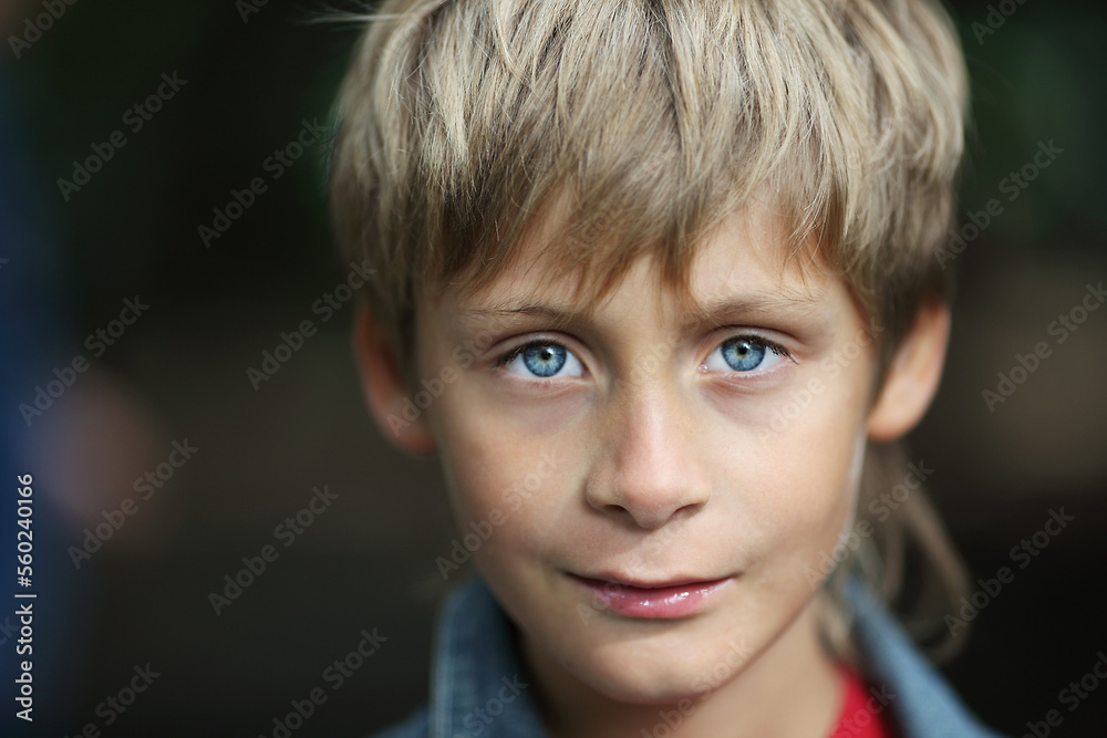 Portrait of a 10 year old boy with blond hair and blue eyes Portrait of a 10 year old boy with blond hair and blue eyes