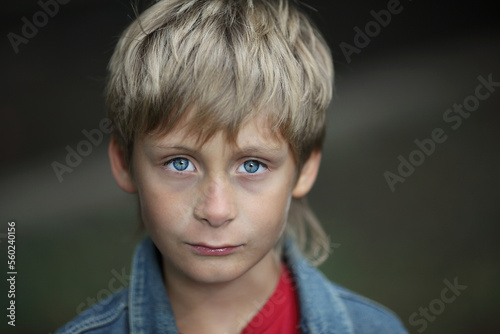 Portrait of a 10 year old boy with blond hair and blue eyes