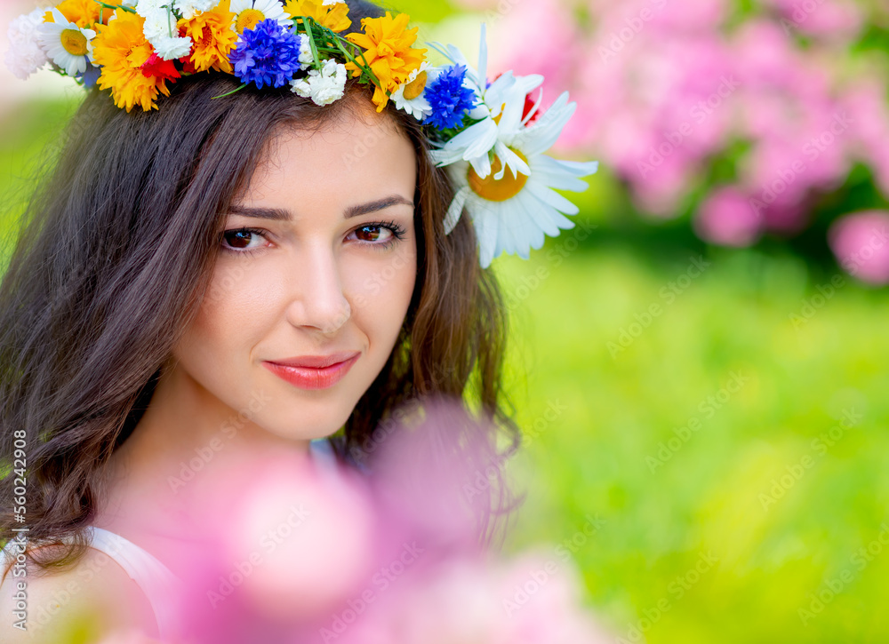 Fairy tale image art photo. Outdoor close up portrait of young beautiful happy smiling fantasy woman. Young goddess enjoys spring nature in bright sunlight and many pink roses Fairy tale image art photo. Outdoor close up portrait of young beautiful happy smiling fantasy woman. Young goddess enjoys spring nature in bright sunlight and many pink roses